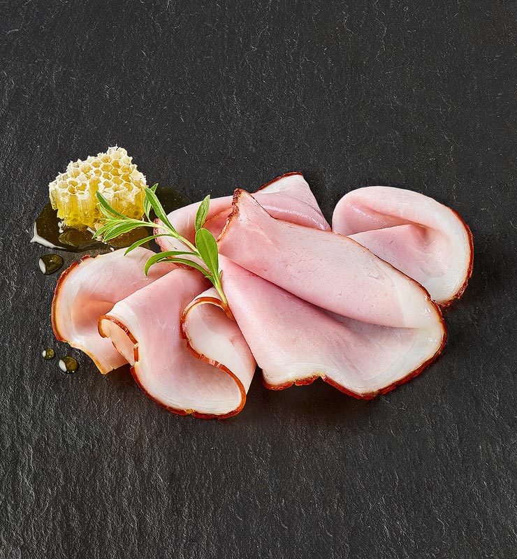 Honigkrustenschinken in Scheiben gelegt